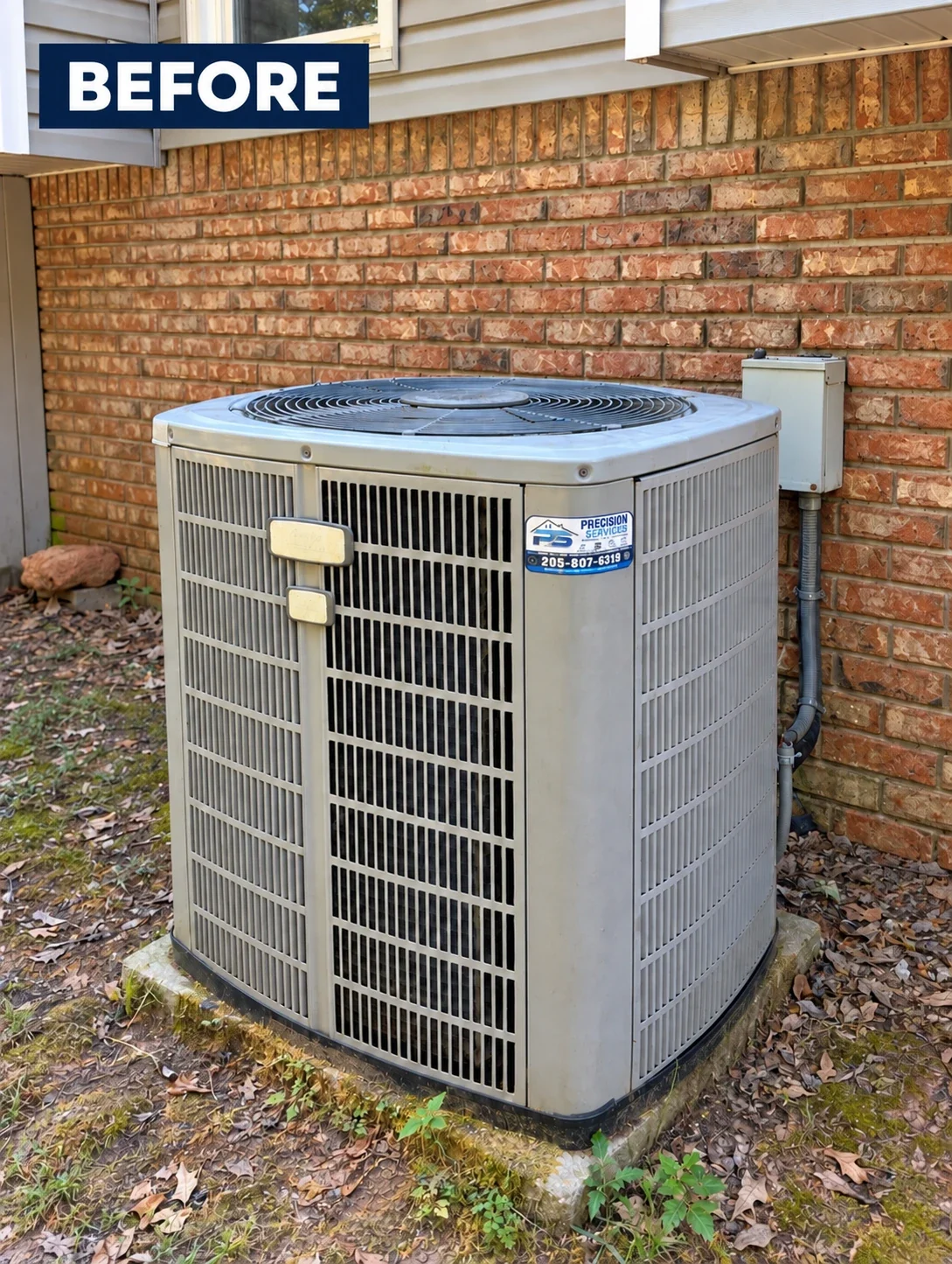 Before: the 20-year-old outdoor AC condenser beside a brick house.